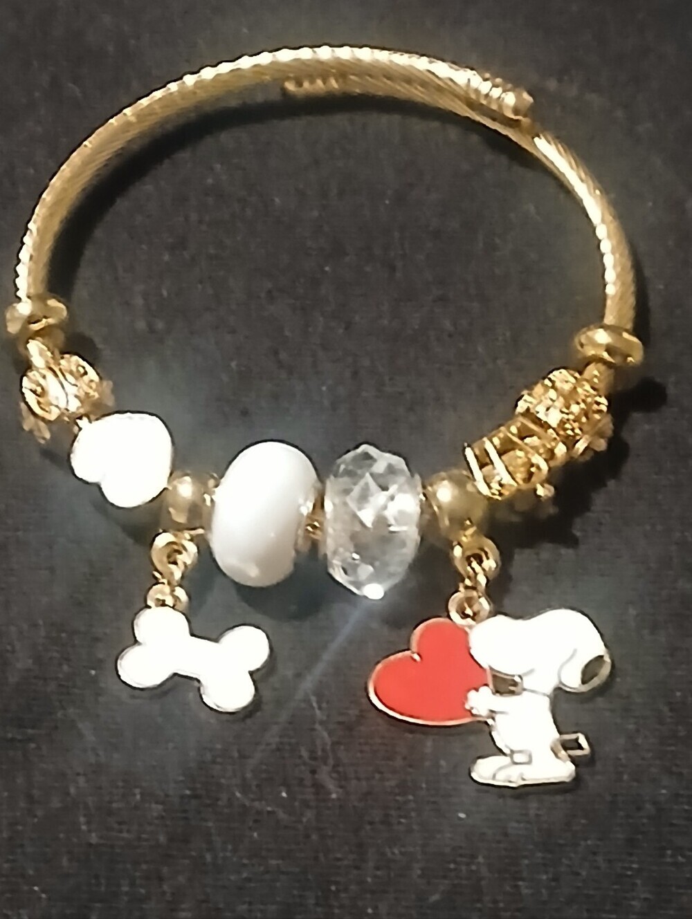 Peanuts -Snoopy Charm Bracelet, 8 charms on Adj. Cuff Style Gold Tone Bracelet